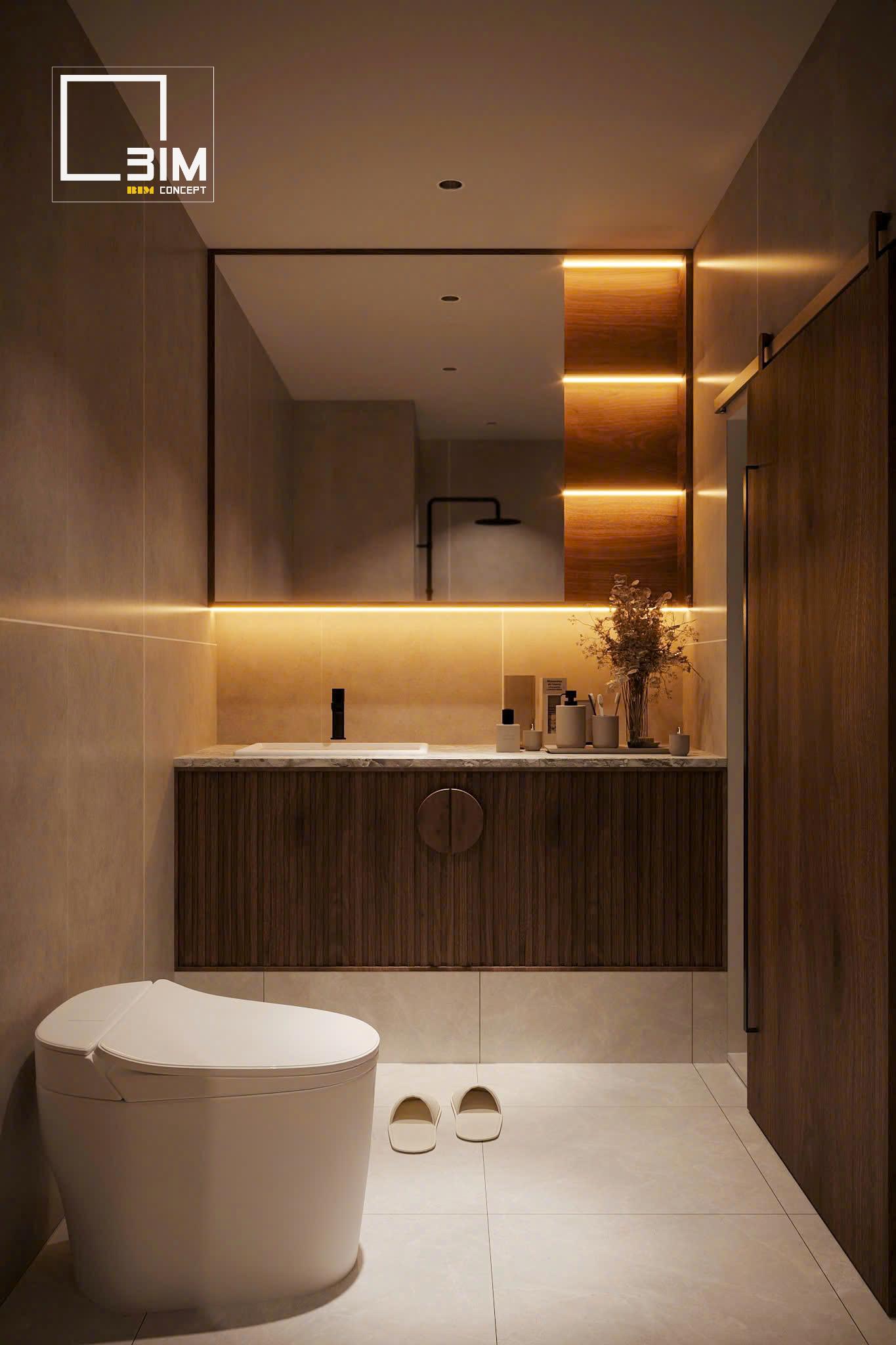 Ánh sáng vàng dịu làm nổi bật tủ lavabo vân sọc gỗ tinh tế
