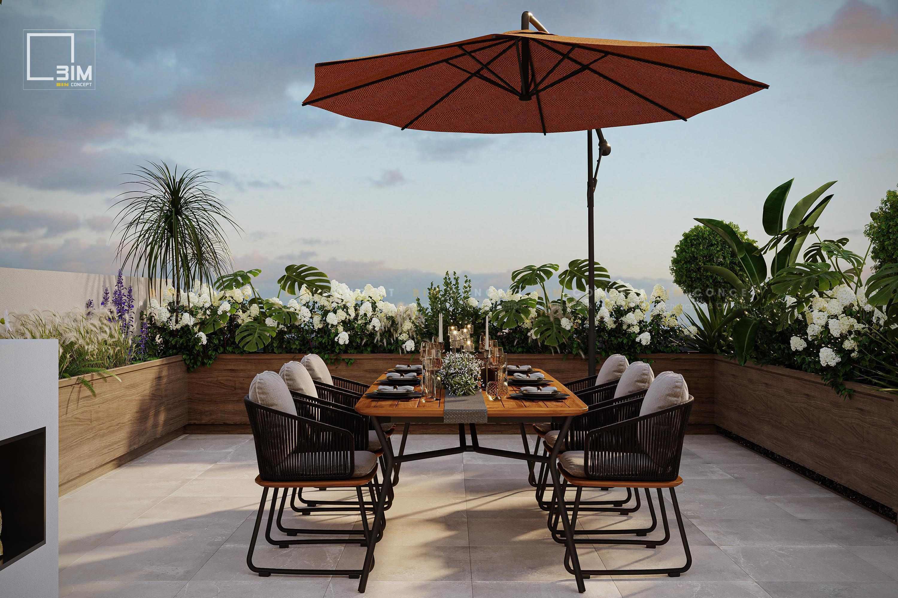 Bàn ăn ngoài trời dưới dù lớn, view ngắm hoàng hôn lãng mạn