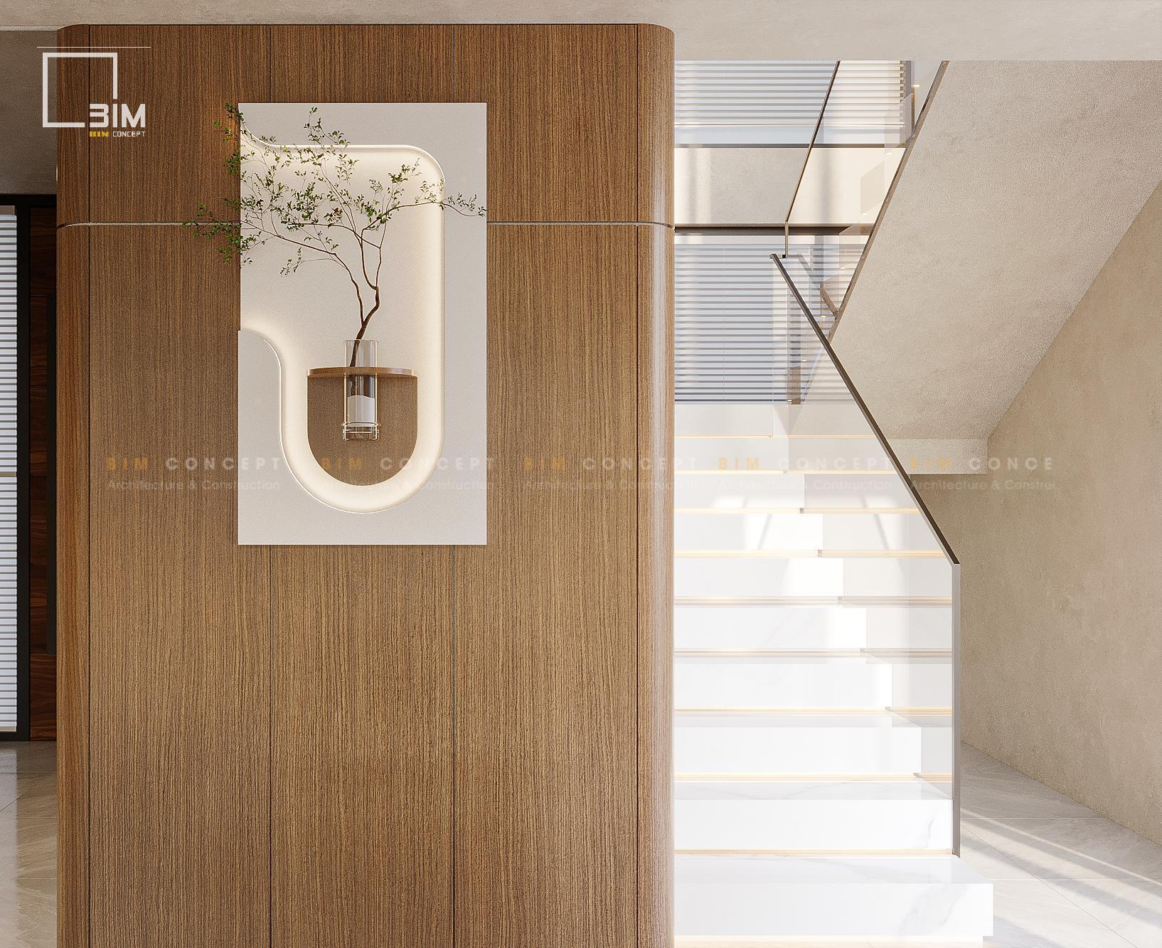 Thiết kế cầu thang trắng và tiểu cảnh treo tường nghệ thuật