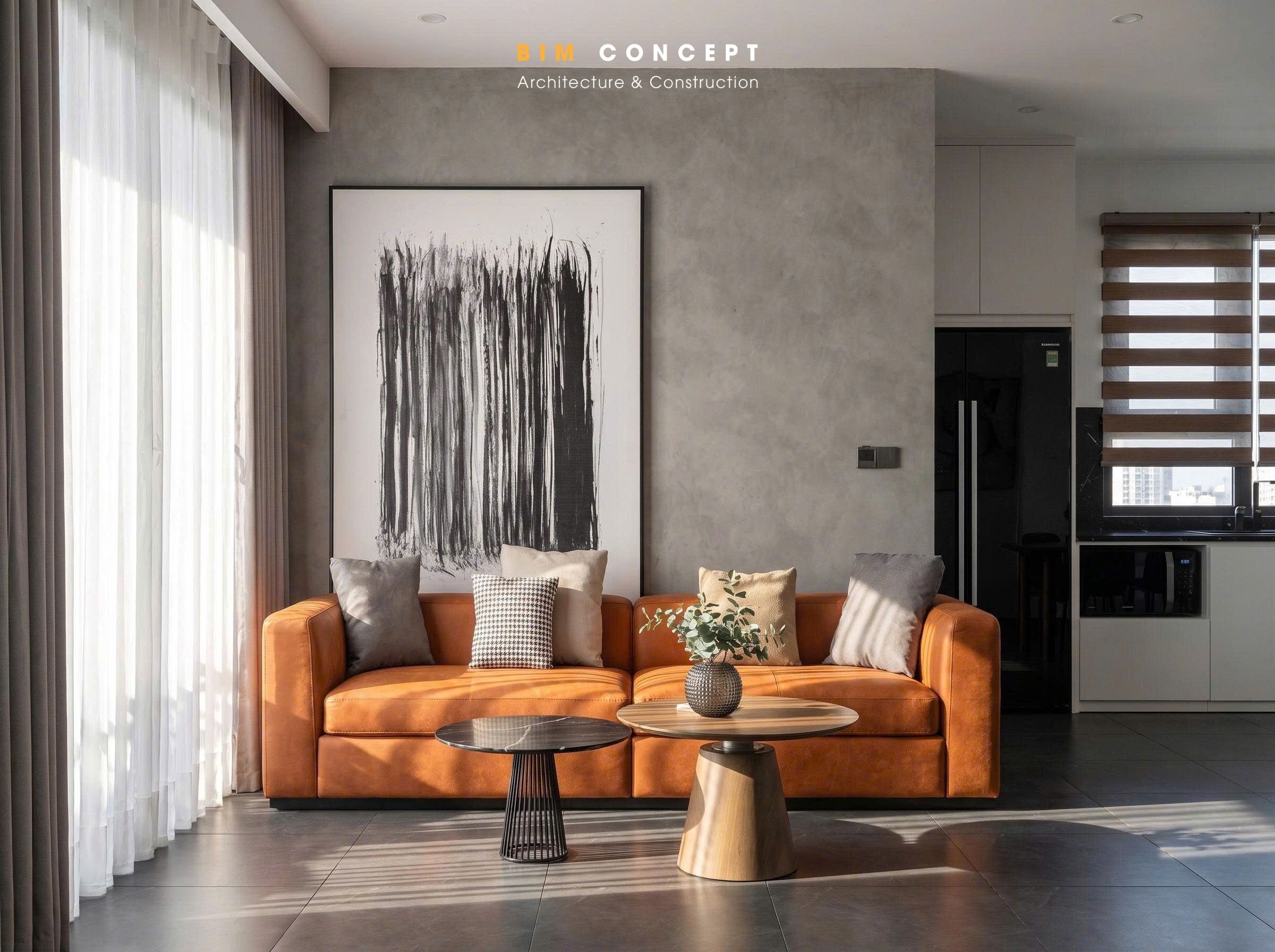 Điểm nhấn nổi bật là bộ sofa da màu nâu cam mang đến cảm giác ấm áp và tạo chiều sâu cho tổng thể