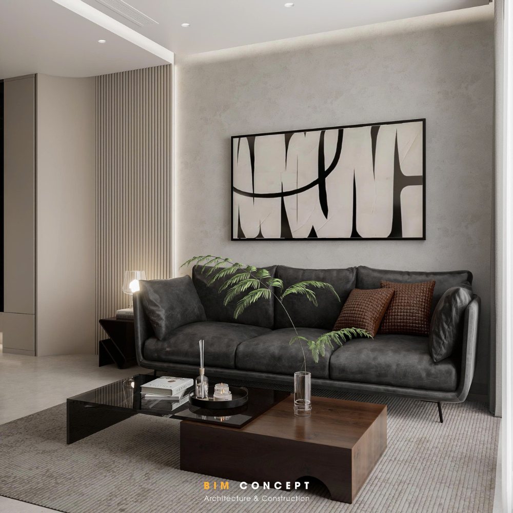 Bộ sofa bọc da màu đen trở thành điểm nhấn nổi bật trên nền tường sáng, kết hợp cùng bàn trà gỗ kiểu dáng tối giản và thảm trải sàn trung tính giúp tổng thể cân bằng.